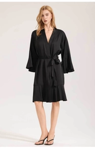 Detailed view of women's black matte satin robe with flare sleeves and elegant V-neckline