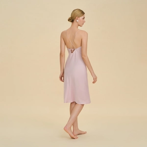Pink satin slip nightgown with V-neck cross back straps and elegant silk-like finish