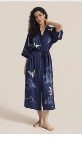 Detailed texture of satin nightgown with oriental crane and pine tree print patterns