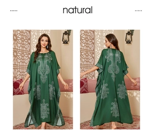 Detailed front and back view of dark green satin kaftan with white ethnic print