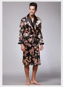 Detail of men's silk satin robe featuring golden dragon prints and a classic black collar