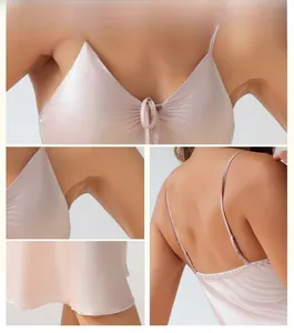Detail view of champagne satin nightdress with bow tie, adjustable straps and open back