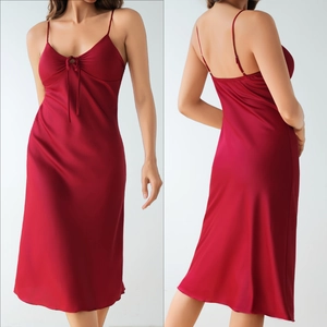Detail view of red satin nightgown with deep V-neck and backless design features