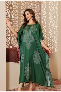 Detailed view of the dark green satin kaftan with white ethnic paisley print and batwing sleeves
