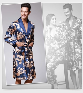 Detail of silk-like blue robe showing golden dragon pattern and shawl collar texture