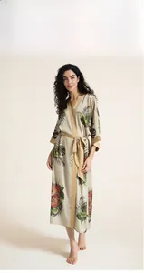 Detail view of champagne silk robe with tropical leaf and tiger print for women