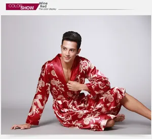 Detail of wine red satin men's robe featuring golden dragon patterns and a waist tie