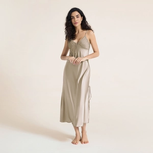 Elegant champagne silk slip dress for women with fine pleats and delicate bow accent