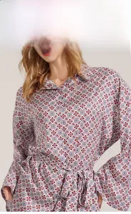 Detail display of women's long sleeve satin shirt with vintage geometric floral pattern