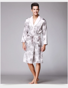 Detail view of smooth satin fabric with vintage baroque patterns on men's sleepwear
