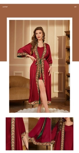 Detailed macro shot of burgundy satin robe with golden scroll embroidery on sleeve edges