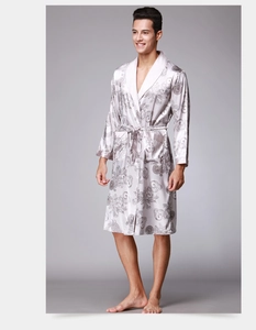 Detail of silver silk satin robe featuring baroque patterns and a classic shawl collar