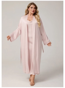 Detailed close-up of smooth pink satin nightgown set featuring elegant draping and texture