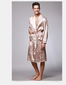 Detail of champagne gold silk satin men's bathrobe with elegant white leaf patterns
