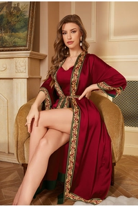 Detail of elegant burgundy satin robe featuring vintage gold floral print on the cuffs