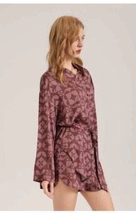 Detail of vintage geometric print satin pajama set with tie-waist and side slits
