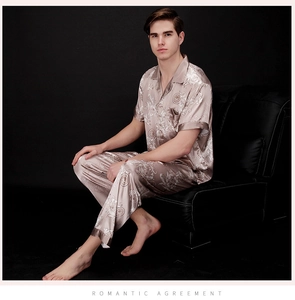 Detail of champagne gold satin pajama set with vintage print and smooth silk texture