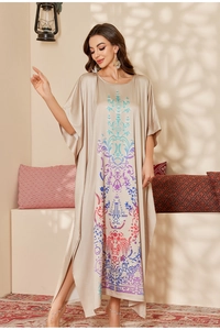 Detail of satin kaftan dress with colorful gradient floral print and side slit design