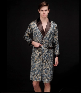Detail of luxury silk-like paisley robe showing satin texture and contrast shawl collar