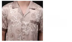 Detail of camel satin pajamas featuring baroque print and smooth silk texture