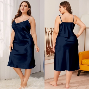 Close-up of navy blue satin nightdress with glossy silk texture and adjustable straps