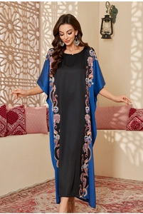 Detail of bohemian floral print and contrast patchwork on a satin long robe