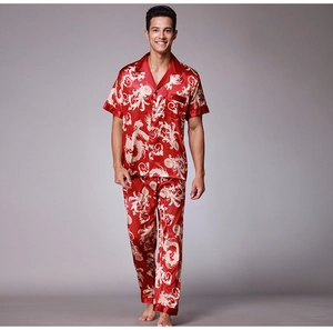 Detail of red satin pajamas set for men with white traditional dragon print