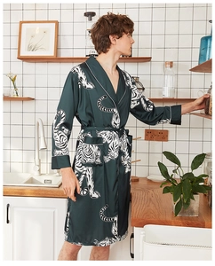 Detail of dark green silk satin robe with tiger print and tie waist belt for men