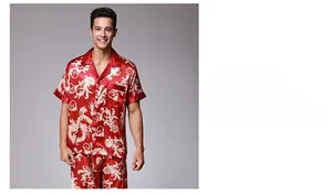 Macro shot of silk texture on red men pajama set with gold dragon print patterns