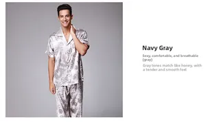 Detail of grey men's short sleeve silk pajamas featuring traditional black dragon prints