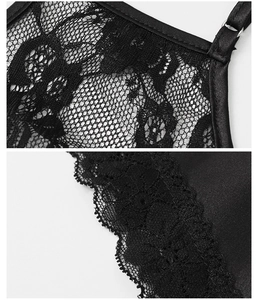 Detail of delicate floral lace mesh with adjustable strap on black satin sleepwear set