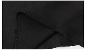 Macro shot of black ice silk fabric showing precise edge stitching and smooth texture