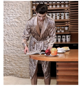 Close-up of luxury silk-like men's bathrobe with intricate baroque scroll patterns