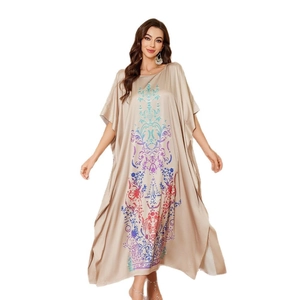 Champagne satin kaftan dress with colorful ethnic prints in a loose bohemian style