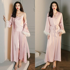 Women's pink silk pajama set with long robe and feather trim sleeves for home luxury