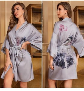 Detail of gray satin robe featuring Chinese floral print, kimono collar, and tied waist