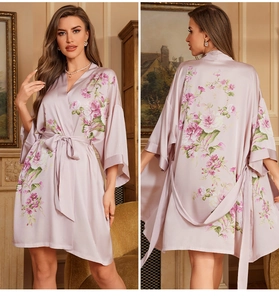 Detail of light purple floral satin robe with three-quarter sleeves and waist tie belt