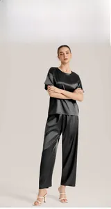 Women's black ice silk pajama set with short sleeve top and wide leg pants