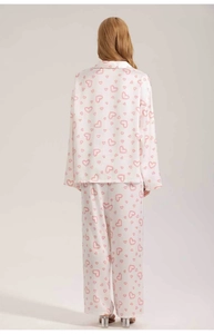 Detailed back view of white satin pajama set featuring cute pink heart line prints