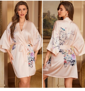 Front and back view of a light pink satin robe with floral and bird print details