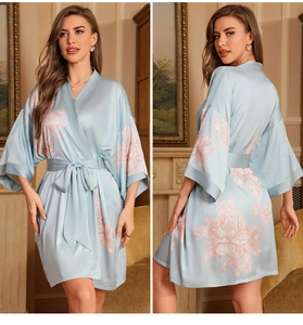 Front and back view of a light blue satin floral bathrobe with pink peony prints