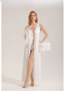 Detailed view of white sheer bridal robe with elegant feather trim on the long sleeves