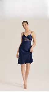 Detail of navy blue satin nightgown featuring intricate lace patchwork and V-neckline