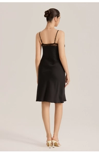 Detailed back view of black satin nightgown featuring delicate lace trim and thin straps