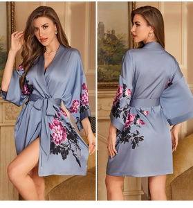 Detail of silk-satin floral bathrobe in dusty blue with pink peonies and wrap belt