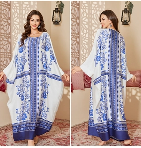 Front and back view of long floral kaftan dress with blue patterns and batwing sleeves