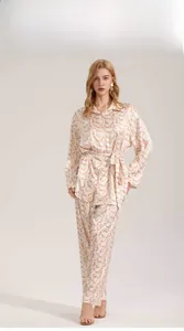 Front view of printed satin pajama set with long sleeve shirt and loose trousers