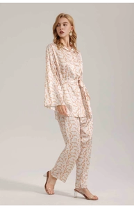 Detail of satin floral print long sleeve pajama set with belt and straight pants
