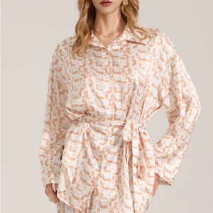 Women's satin lounge set with long sleeves and geometric print on cream background