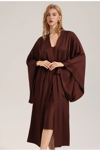 Detail of elegant dark brown satin robe with wide sleeves and glossy silk-like texture